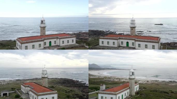 蓬塔拉里诺灯塔无人机鸟瞰图景观和海滩，在西班牙北部海岸