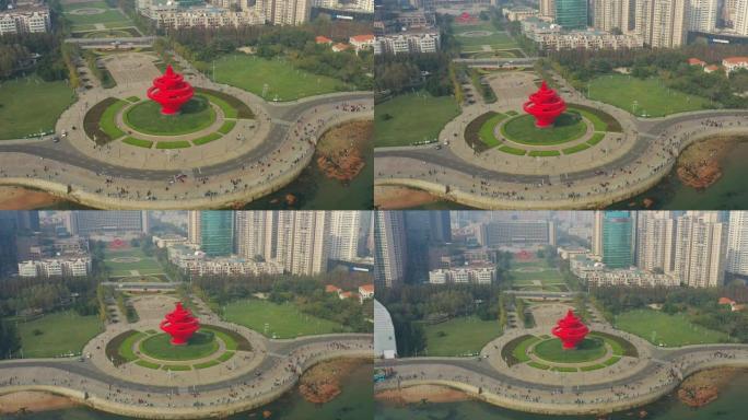 青岛市晴天步行湾著名纪念碑广场空中俯拍全景4k中国