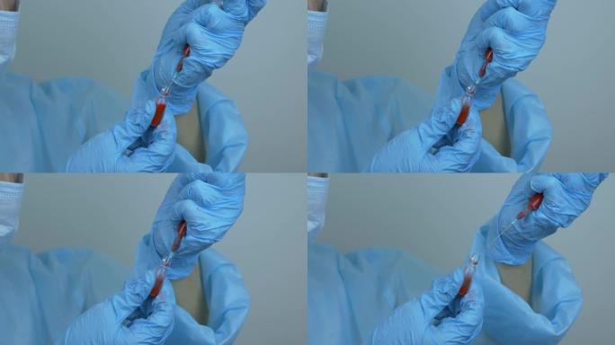 护士用nCoV冠状病毒疫苗填充注射器，用于2019 nCoV冠状病毒病毒。护具中的劳动者准备注射注射