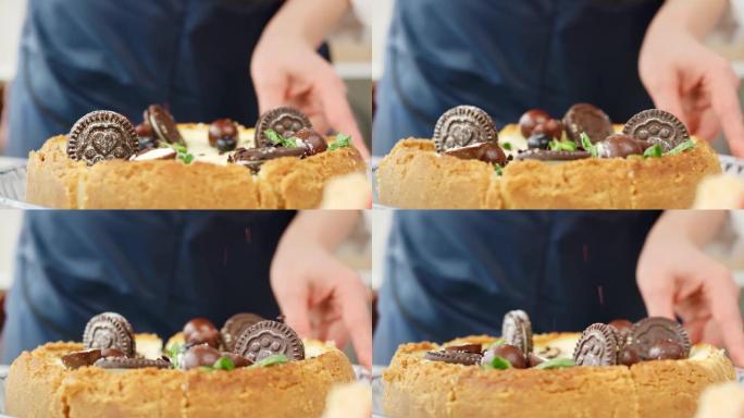 女性糖果手在新鲜蛋糕上撒上巧克力片。在4k红色相机上近距离拍摄