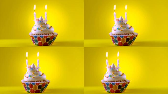 生日装饰有两支蜡烛的纸杯蛋糕 -- 滑动镜头