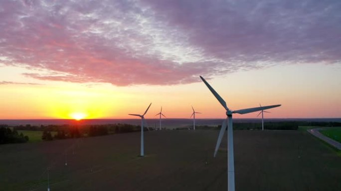 日落时风车涡轮机能源生产的鸟瞰图