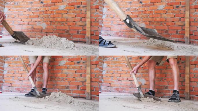 铲子挖沙。施工概念。铲子。用铁锹在红砖墙附近挖沙