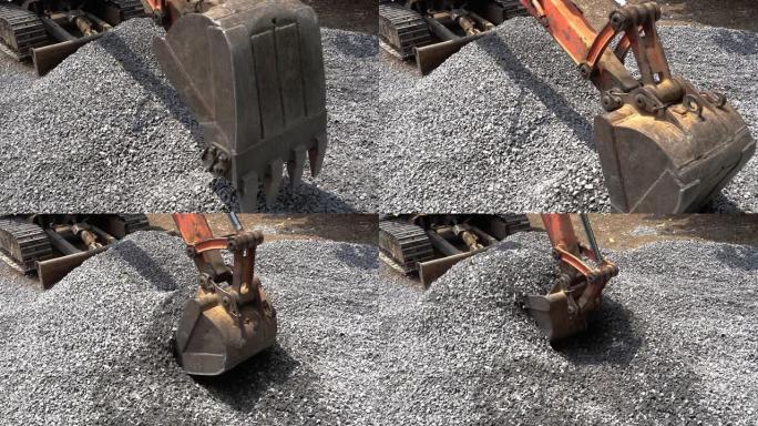 挖掘机正在挖掘石头，用于农村地区的道路建设或修复背景。