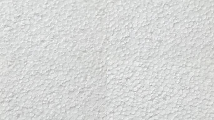 白色聚苯乙烯泡沫塑料的旋转表面