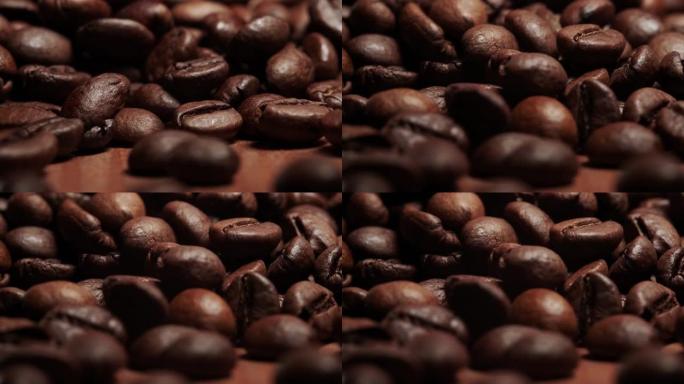 烤棕色咖啡豆从顶部撒上，前视图。