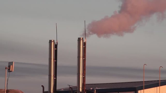 smoke from the boiler room chimney on the roof of 