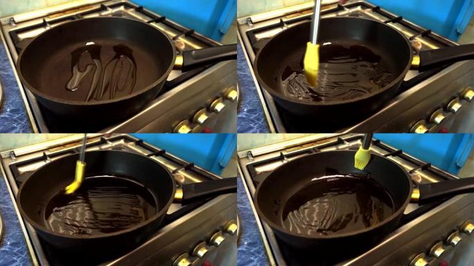 将植物油倒入煎锅中进行烹饪。带有不粘涂层的黑色平底锅立在燃气灶上。