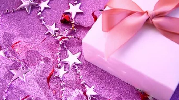 圣诞快乐或情人节背景由紫色和粉红色背景上的装饰品、火花和五彩纸屑制成