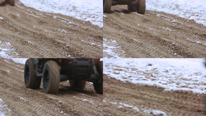 ATV的车轮通过沙子驱动