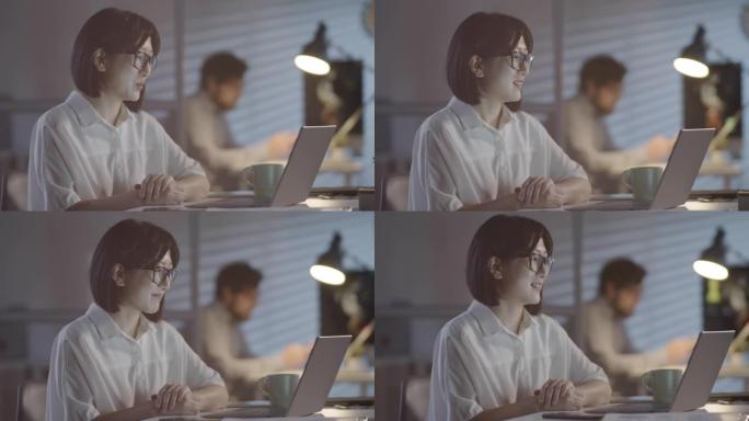 Businesswoman Talking on Video Call in Dark Office