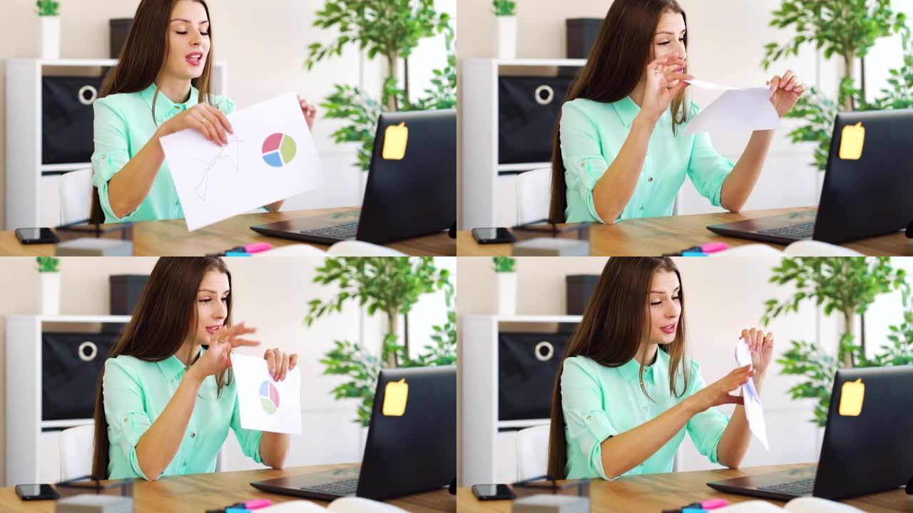 恼怒的女老板在办公室视频通话时撕纸