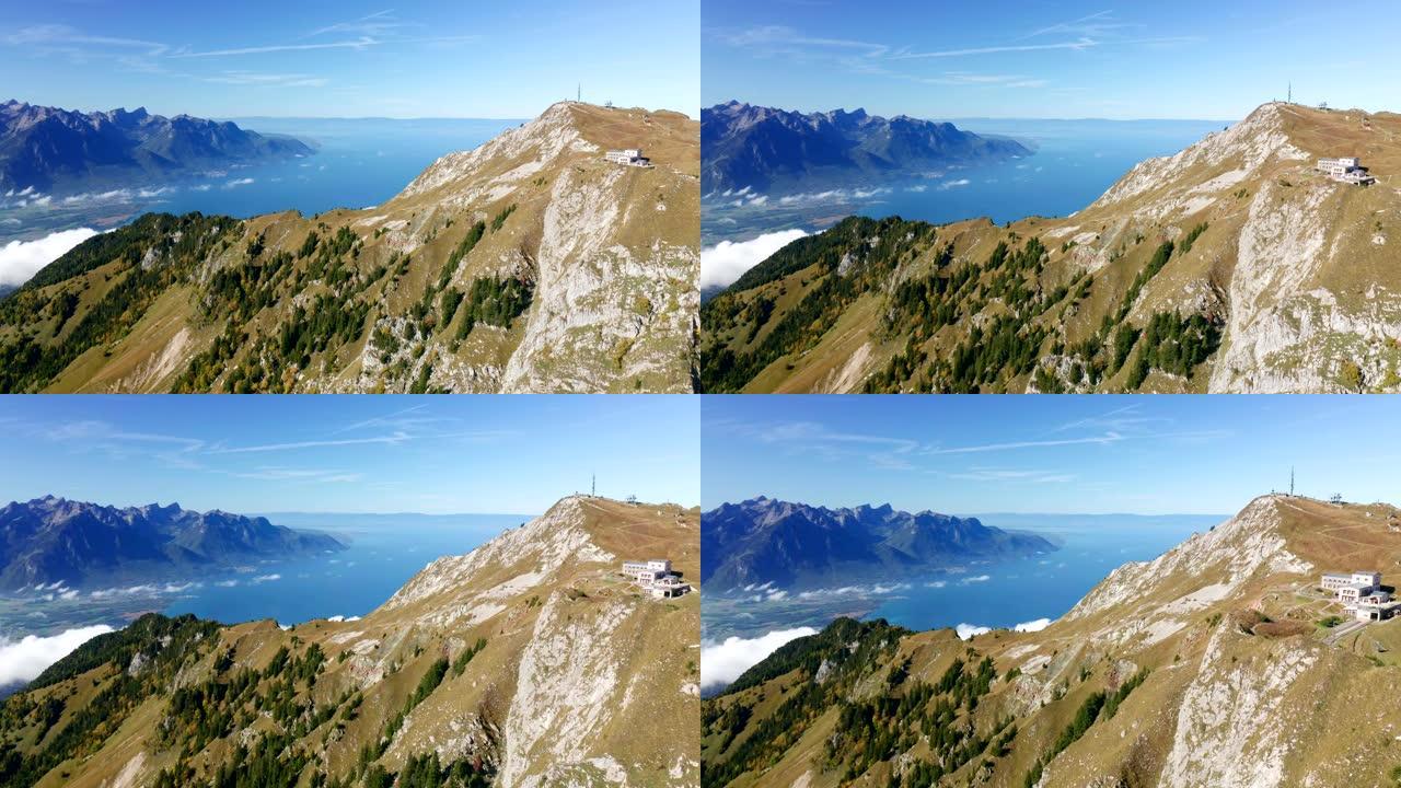 晴天与日内瓦湖一起在瑞士阿尔卑斯山附近拍摄直升机