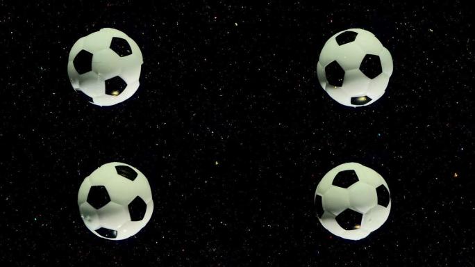 足球在黑色太空恒星背景上绕其轴旋转，并带有多色的火花