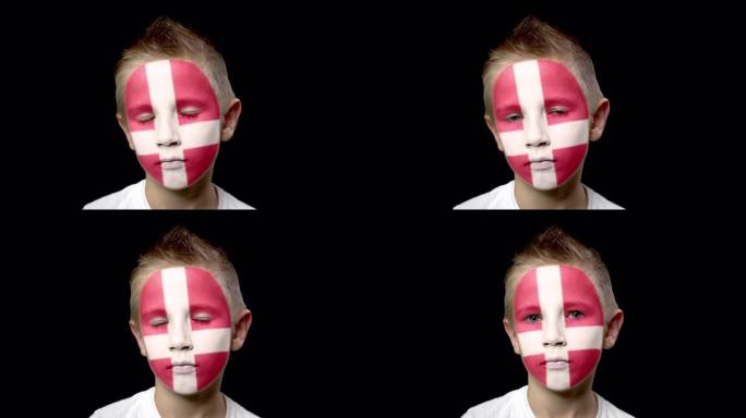 可怜的丹麦足球队球迷。脸上涂着民族色彩的孩子。