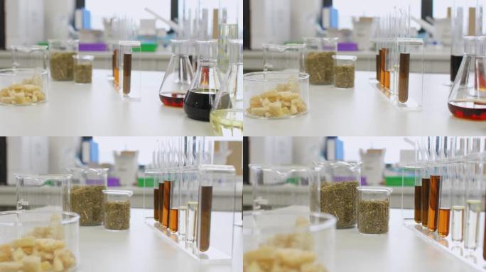 实验室桌上玻璃中的CBD油，大麻籽和萜烯