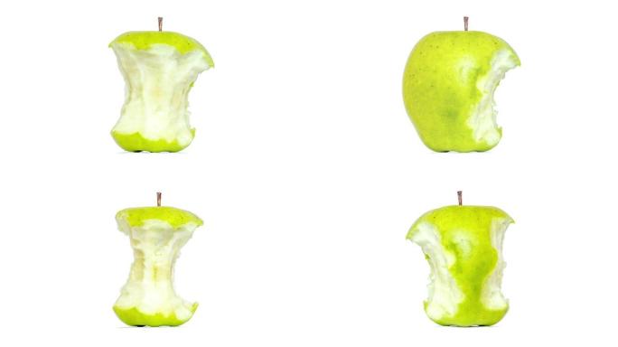 创意4k视频，一个绿色苹果微距特写镜头隔离在白色背景上，迅速吃掉了一个存根。从整体到存根的青苹果。停