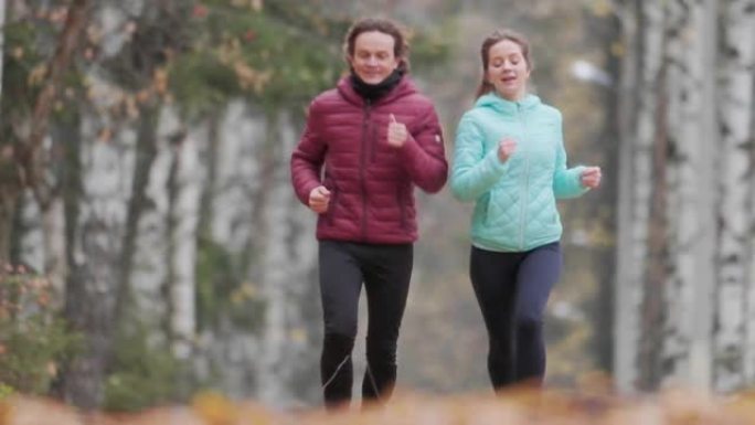 Couple run along the path