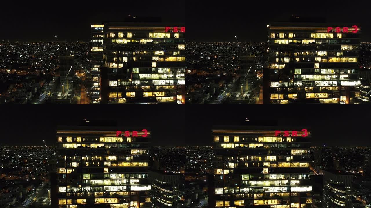 空中无人机在夜间在大都会城市景观和摩天大楼上拍摄
