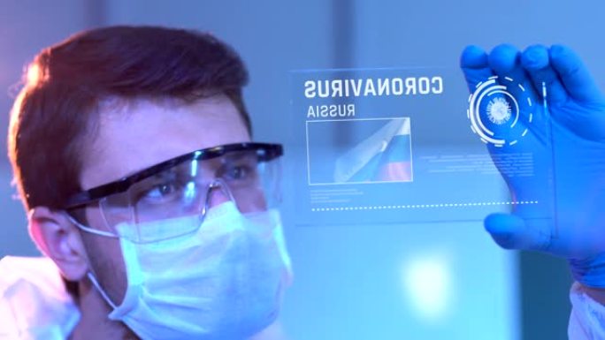 研究人员正在研究俄罗斯的冠状病毒结果。实验室数字屏幕上的俄罗斯国旗