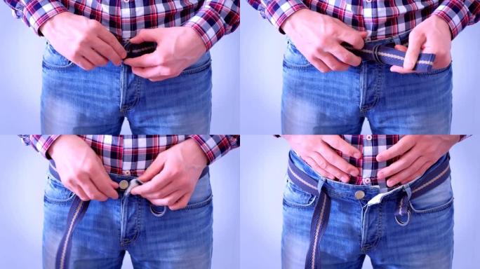 男人几乎不扣牛仔裤的腰带，拉肚子，手特写。