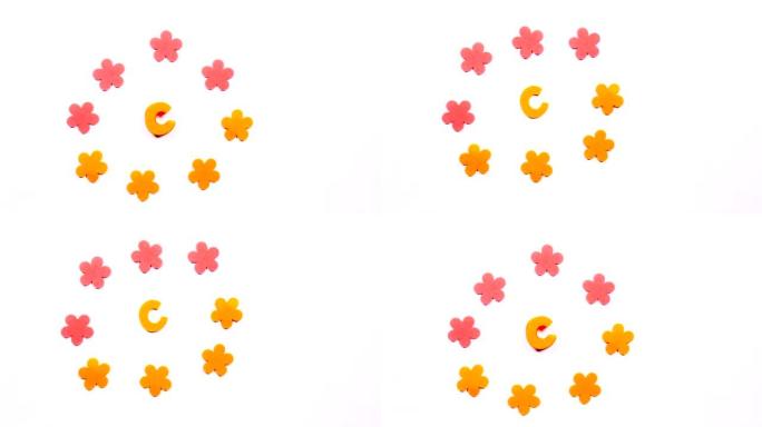 移动英文字母表的黄色字母C。白色背景上的舞蹈字母。