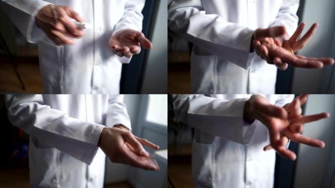 医院的医生使用手部凝胶消毒剂来保护手部免受冠状病毒。