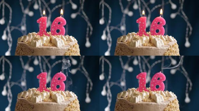 蓝色背景上有16号粉色蜡烛的生日蛋糕。蜡烛吹灭了。慢动作和特写视图