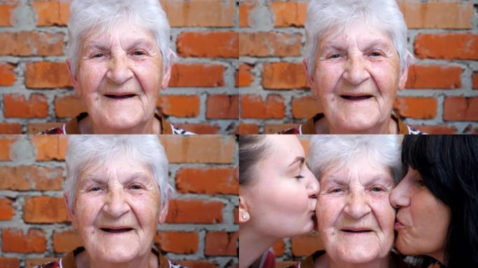 年轻女孩和成年妇女亲吻他们心爱的祖母的脸颊。快乐奶奶微笑着看着镜头的肖像。温暖的家庭关系。爱或关怀的