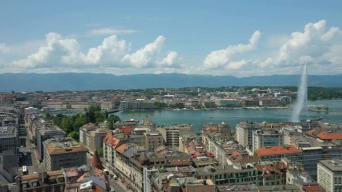 飞越阳光明媚的日内瓦中央城市景观湖边喷泉屋顶空中全景4k瑞士