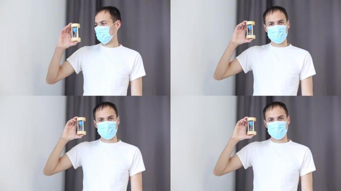 中年男子在防护医用面具与铭文2019-ncov，呼吸深刻和平静，肩膀上下移动。冠状病毒流行感染新型冠