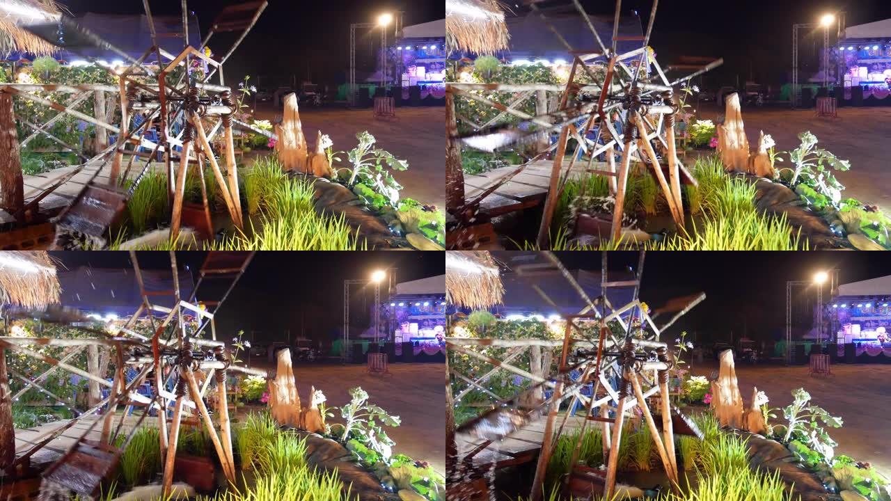 泰国节日之夜的旋转水旧竹木轮