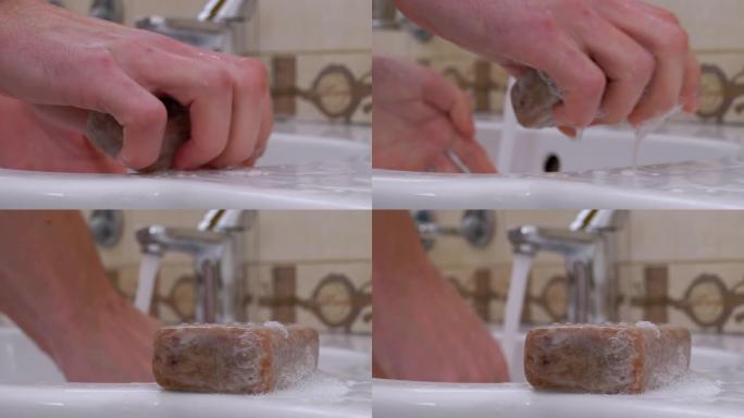 男子在浴室用洗手液洗手。保护冠状病毒
