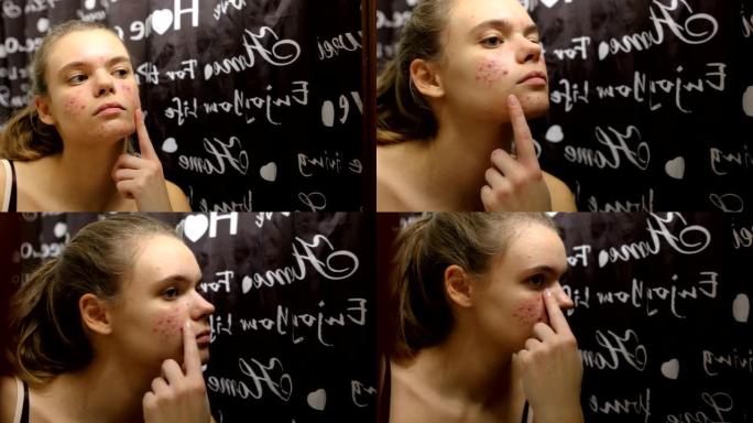 十几岁的女孩在浴室的脸上涂抹精油