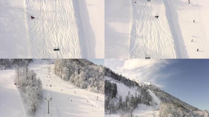 无人机飞越山区度假胜地雪坡上移动的滑雪电梯。顶部鸟瞰式滑雪缆车运送雪山上的滑雪者和滑雪者。雪域高原的