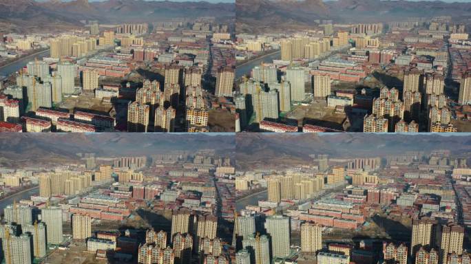 航拍县城北方日出后的城镇