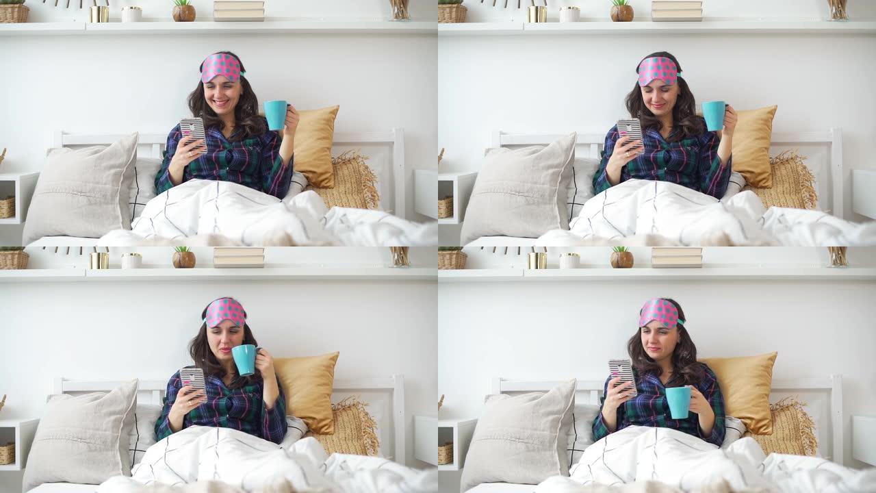 女人早上在床上使用智能手机