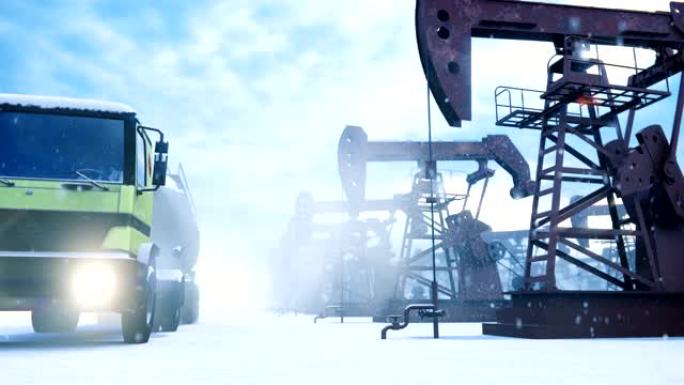 工业油泵在冬季运行，并在油田中泵送原油。经过油泵的油车。