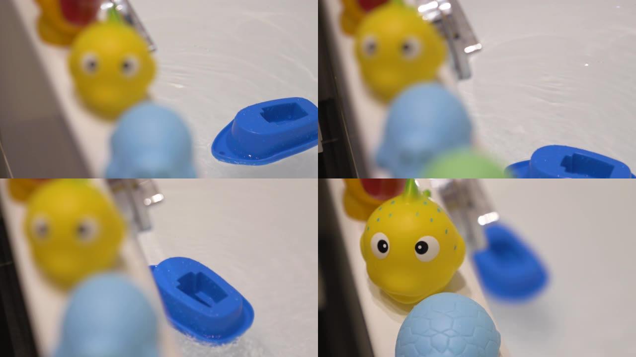 漂浮在浴缸中的橡胶软质玩具和塑料船