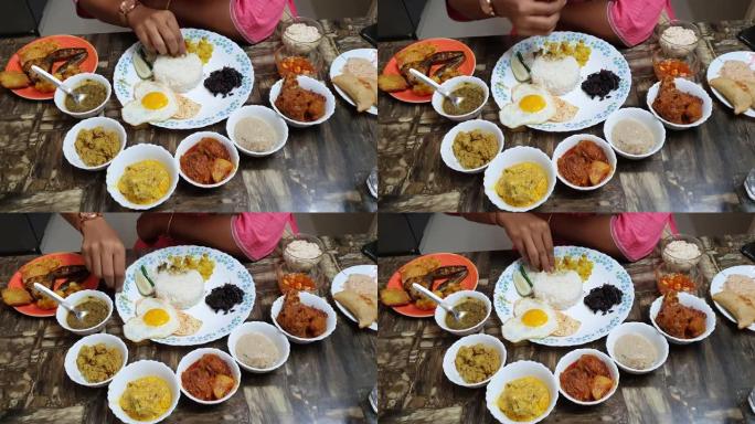 印度餐，大盘子里有鸡蛋蔬菜和不同类型的甜点，婴儿洗澡时会吃的小菜