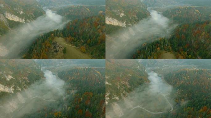 空中拍摄被神秘包围的山湖。无人机的观点，在雾中的塞尔维亚塔拉山。