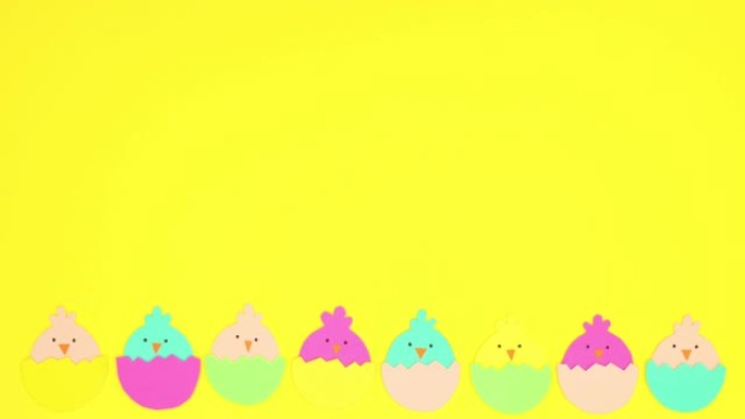带有鸡的复活节彩蛋出现并从黄色背景中消失-停止运动