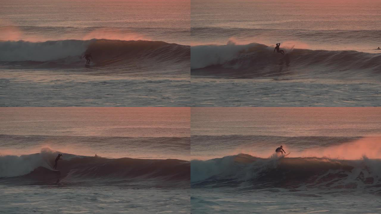 一位专业冲浪者在日落/日出时冲浪完美波浪的美丽照片。