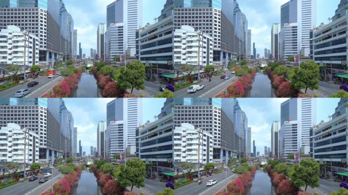 泰国曼谷市中心天际线沙吞路口或与汽车交通交汇处。金融区和商业区。智慧城市城市。日落时的摩天大楼和建筑
