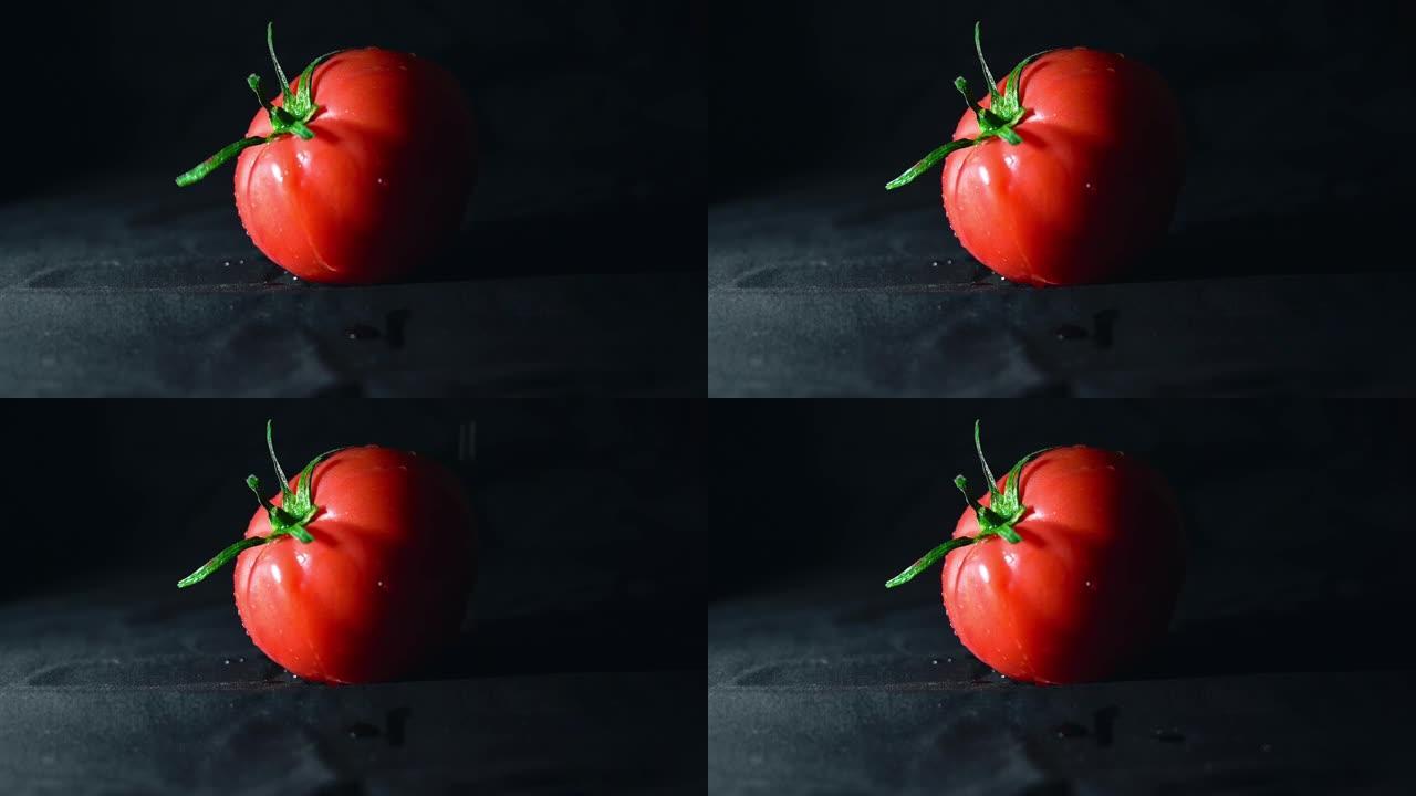 番茄在黑色背景上旋转，慢动作