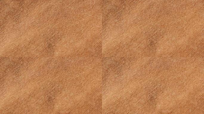 棕色天鹅绒面料，适用于裤子或衬衫等服装，慢倾斜4K