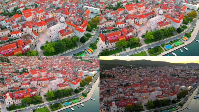 空中无人机观看克罗地亚亚得里亚海历史名城西贝尼克老城和圣詹姆斯大教堂的日落场景