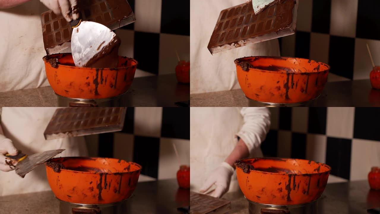 糕点面包师用融化的巧克力填充立方体形状的模具