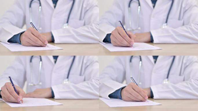 医生在纸上写字的手关闭