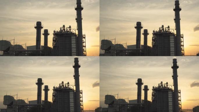 工业区的燃气轮机发电厂。日落时的发电厂。